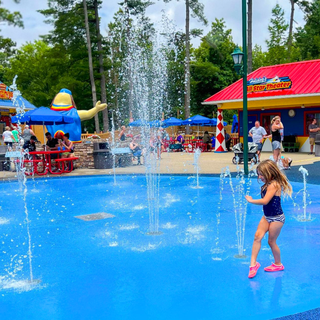 HoliBlogger Stephanie's daughter playing in Magic Waters.