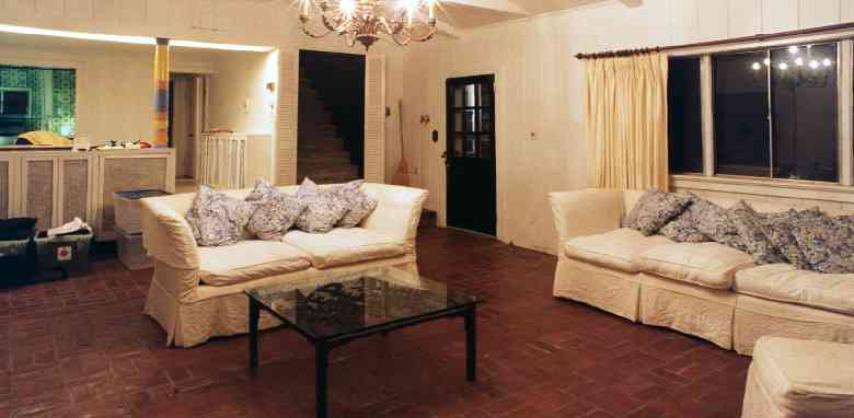 An evening view of the livingroom, one week before the furniture was taken to Oxford.